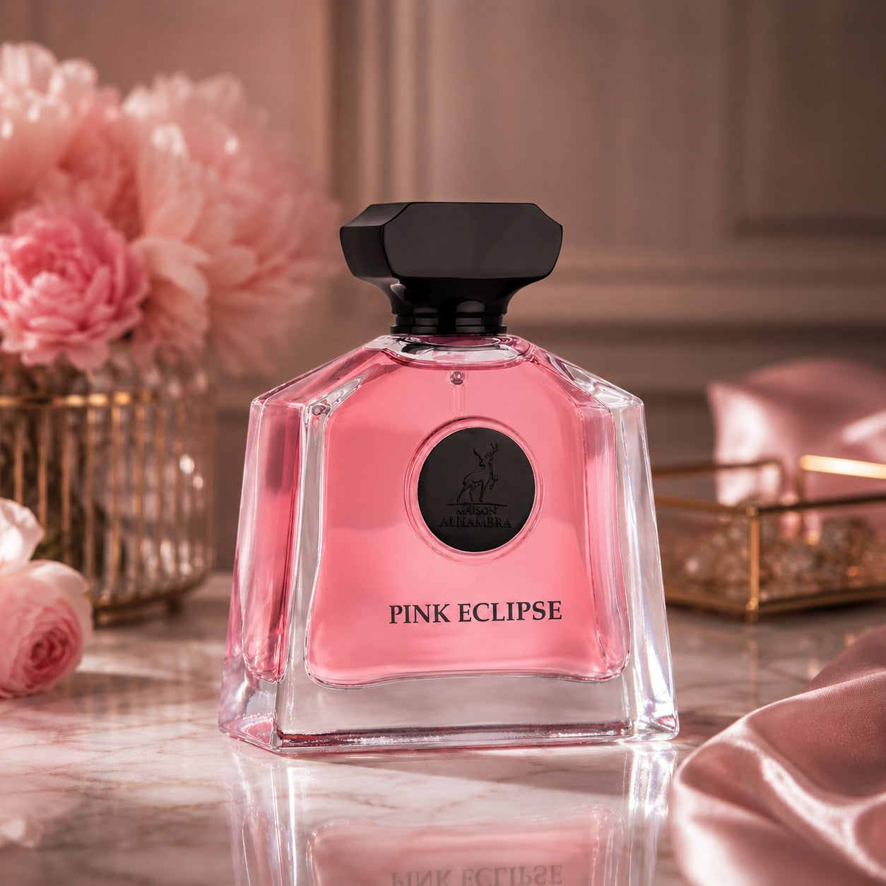 Soghaat Maison Alhambra Pink Eclipse Eau de Parfum in a clear glass bottle with pink liquid and black cap on marble.