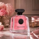 Soghaat Maison Alhambra Pink Eclipse Eau de Parfum in a clear glass bottle with pink liquid and black cap on marble.