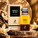 Soghaat Maison Alhambra Vanilla Blush Eau de Parfum bottle and box with vanilla flowers and pods on a stone surface.