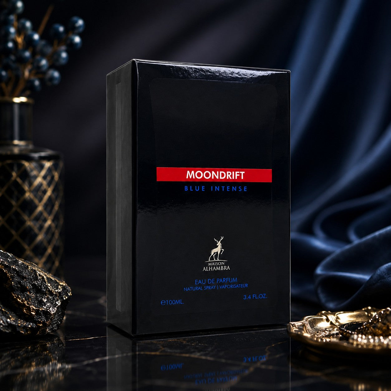 Soghaat Moondrift Blue Intense Eau de Parfum by Maison Alhambra in a sleek black box on a dark marble surface.
