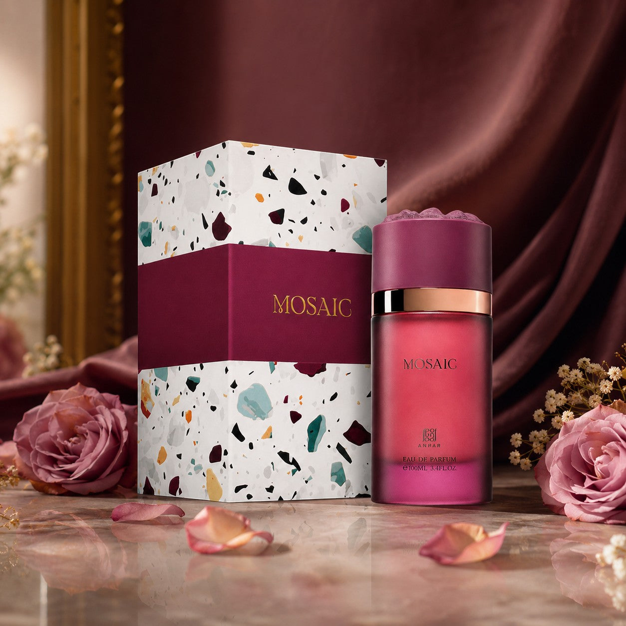 Soghaat Mosaic Extrait de Parfum bottle and box with terrazzo pattern, surrounded by roses on a marble surface.