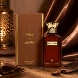 Soghaat Musk And Leather 100ml Eau de Parfum bottle and box with gold accents on a warm, elegant brown background.