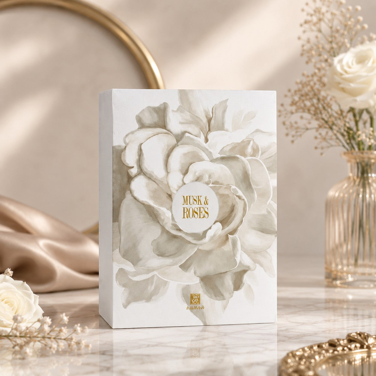 Soghaat Musk & Roses Extrait de Parfum box featuring elegant floral artwork on a marble surface with white roses.