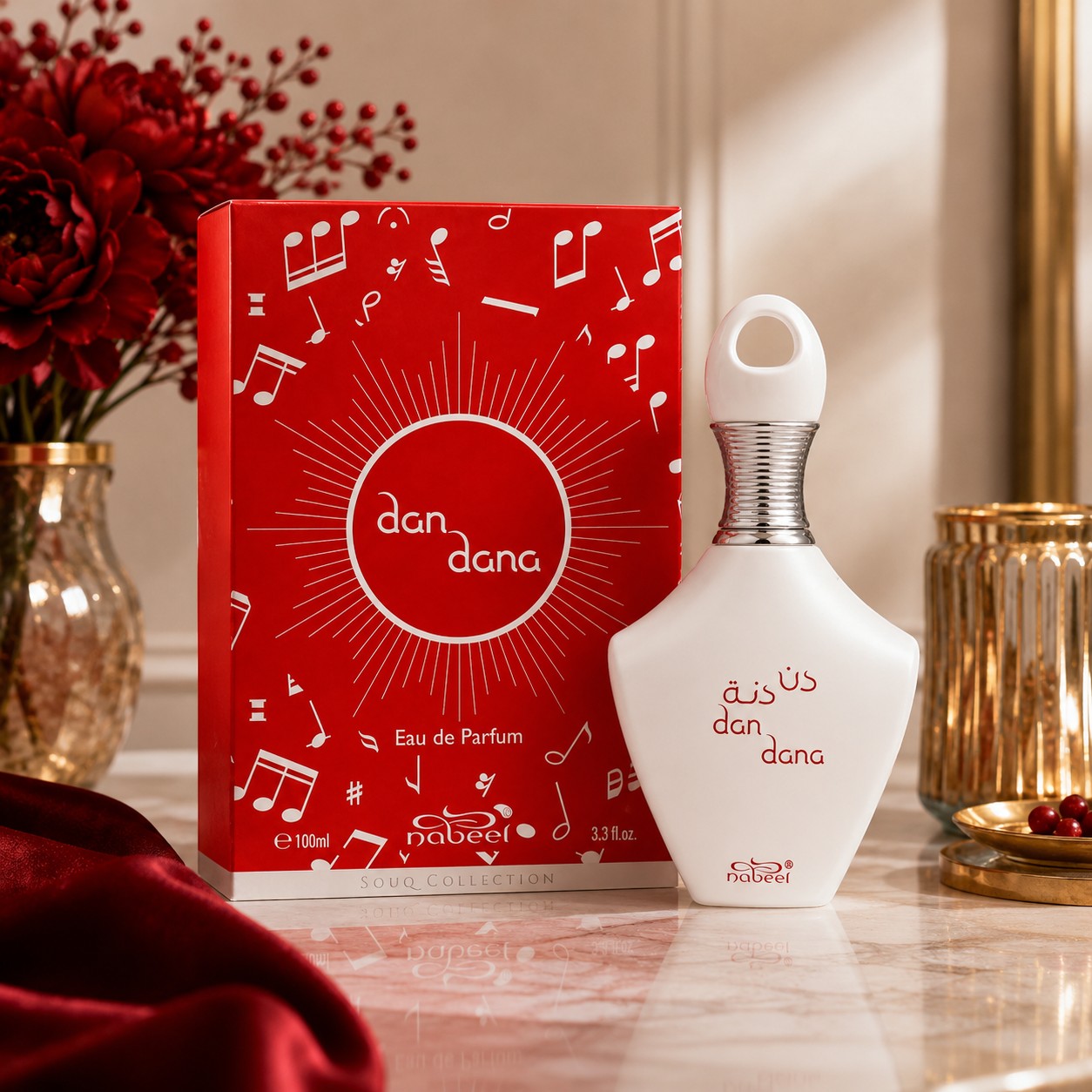 Soghaat Nabeel Dan Dana 100ml Eau de Parfum bottle and red music-themed box on a marble table with red flowers.
