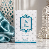 Soghaat Nabeel Ma'Alaina 100ml Eau de Parfum box with teal and silver geometric patterns on a marble surface.