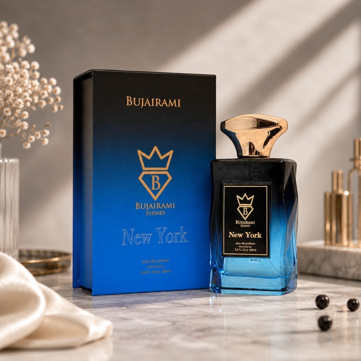 Soghaat New York Eau de Parfum 100ml bottle with blue gradient and gold cap, next to its matching box.