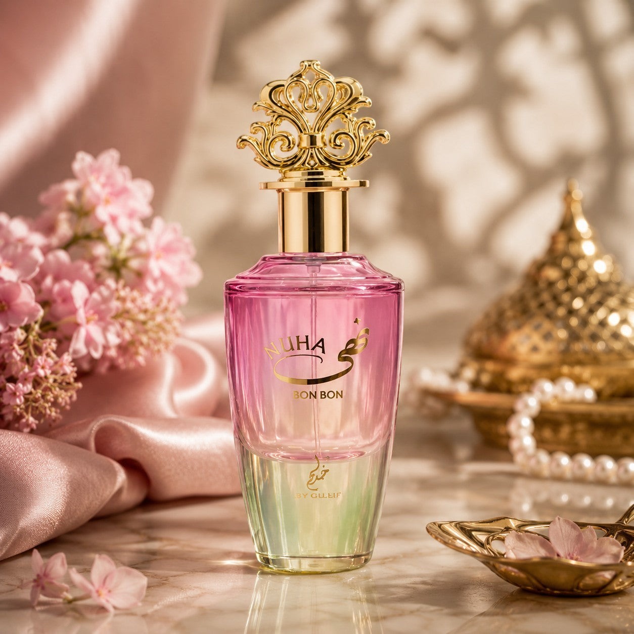 Soghaat Nuha Bon Bon 85ml Eau de Parfum, a unisex fresh floral gourmand fragrance with a gradient pink to green glass bottle and ornate gold cap.