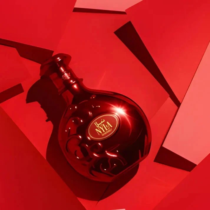 Arabiyat Prestige Nyla Sherbet Eau de Parfum, a rich red bottle with ornate detailing and a gold label.