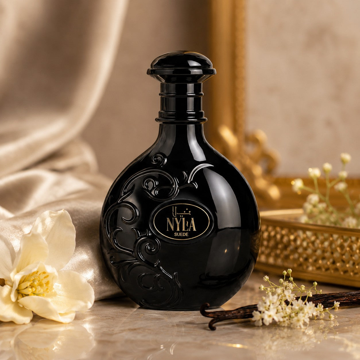 Soghaat Nyla Suede Eau de Parfum in a sleek black round bottle with gold lettering, styled with vanilla and flowers.