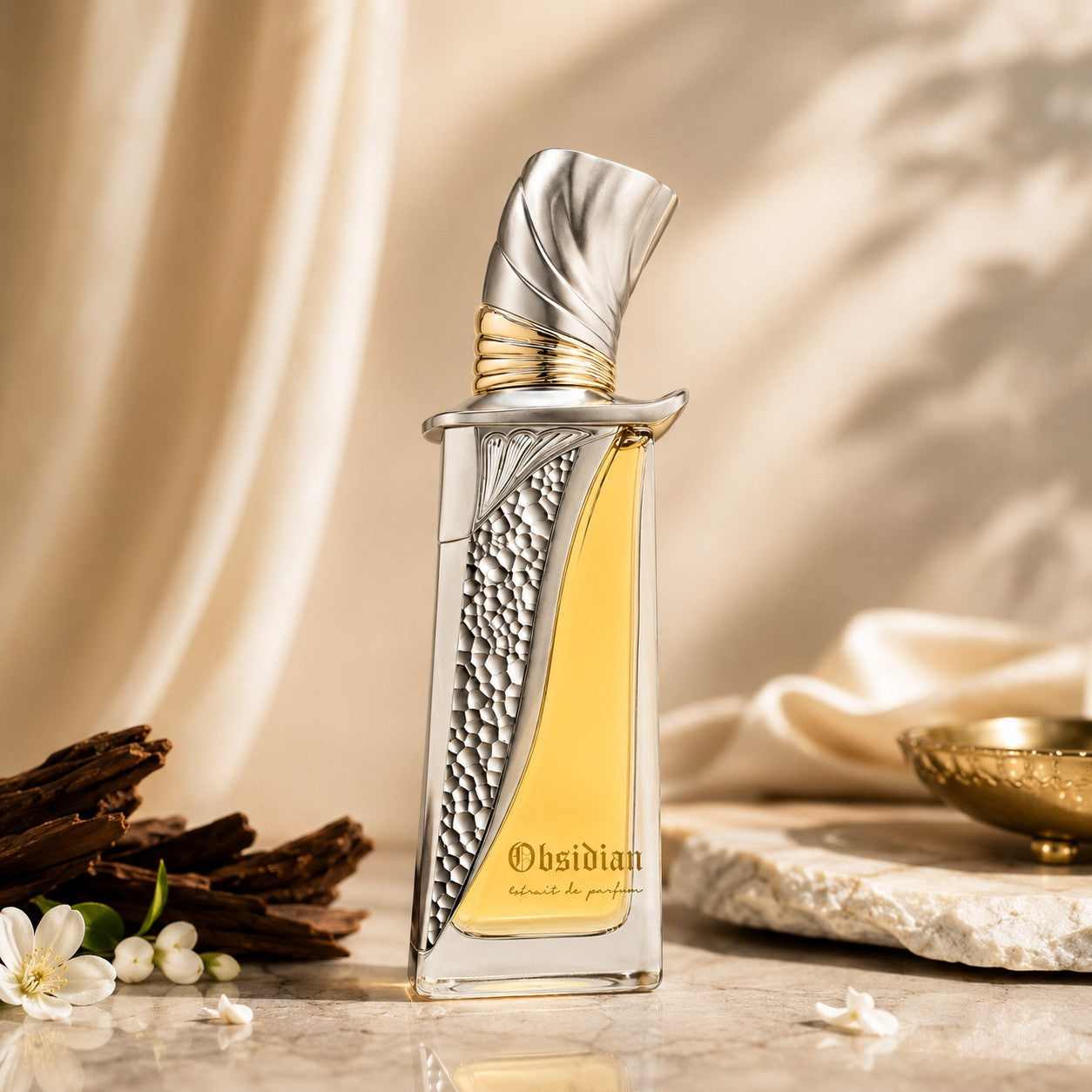 Soghaat Obsidian Extrait de Parfum, a fresh woody aromatic fragrance with a bright, warm profile in a decorative silver and gold bottle.