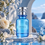 Soghaat Osma Ambry A unisex Eau de Parfum in a blue glass bottle with rose engravings, set against a coastal backdrop.