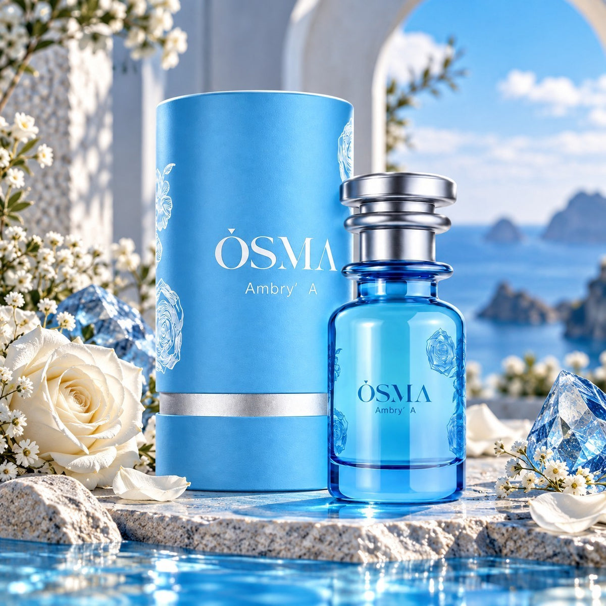 Soghaat Osma Ambry A Eau de Parfum in a blue glass bottle and matching cylindrical box with white roses by the sea.