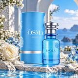 Soghaat Osma Ambry A Eau de Parfum in a blue glass bottle and matching cylindrical box with white roses by the sea.
