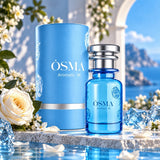 Soghaat Osma Aromatic M unisex Eau de Parfum in a blue glass bottle and matching cylindrical box on a stone surface.