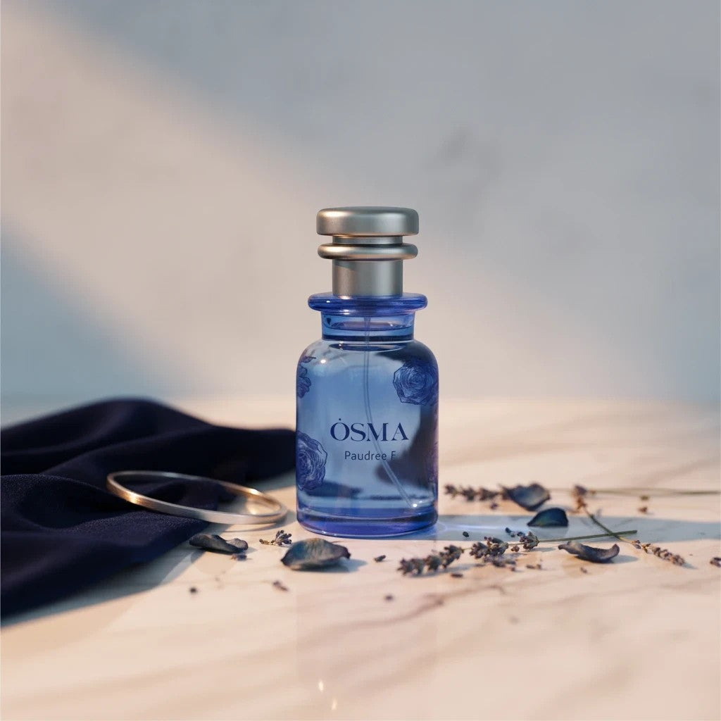 Soghaat Osma Paudree F Eau de Parfum bottle with floral and musk notes, silver cap, blue glass.