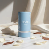 Soghaat Osma Rose P Eau de Parfum, a soft sweet musk fragrance for women, in a light blue cylindrical bottle with rose motifs.