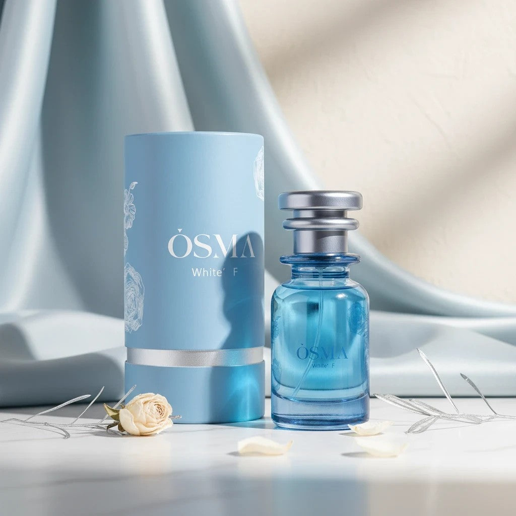Soghaat Osma White F Eau de Parfum, a sweet gourmand fragrance with blackberry and maltol notes, in a blue glass bottle with a light blue cylindrical box.