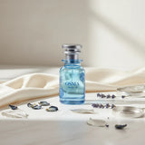 Soghaat Osma Woody W Eau de Parfum, a fresh woody aromatic fragrance with bergamot, maltol, and leather notes in a blue glass bottle.