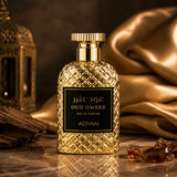 Soghaat Oud Ombre by Adyan Anfar Eau de Parfum in a gold textured bottle with a black label on a marble surface.