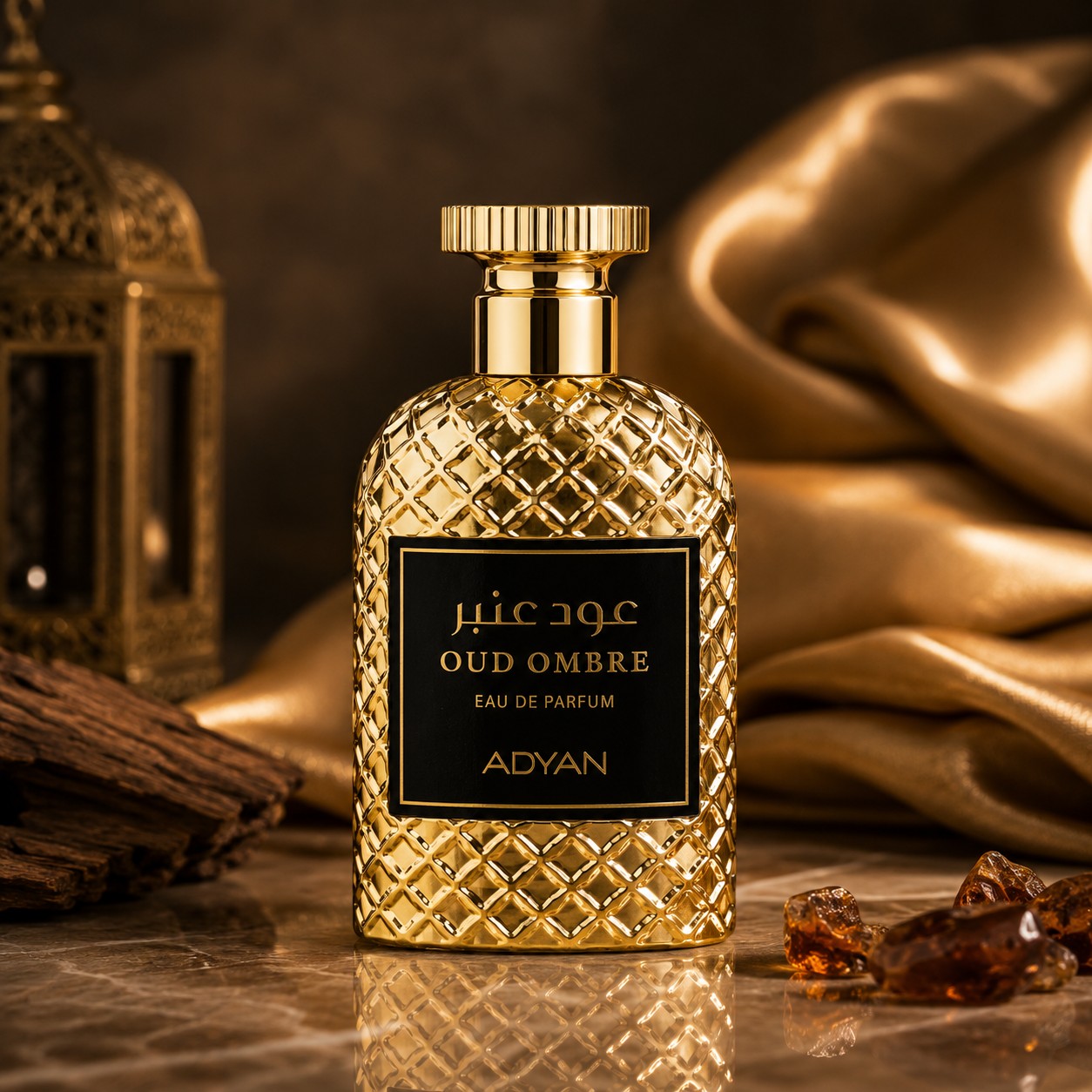 Soghaat Oud Ombre by Adyan Anfar Eau de Parfum in a gold textured bottle with a black label on a marble surface.