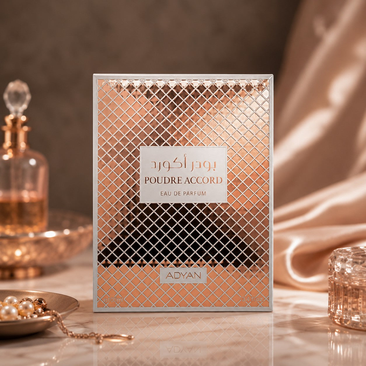 Soghaat Poudre Accord by Adyan Anfar Eau de Parfum box with rose gold lattice design on a marble surface.