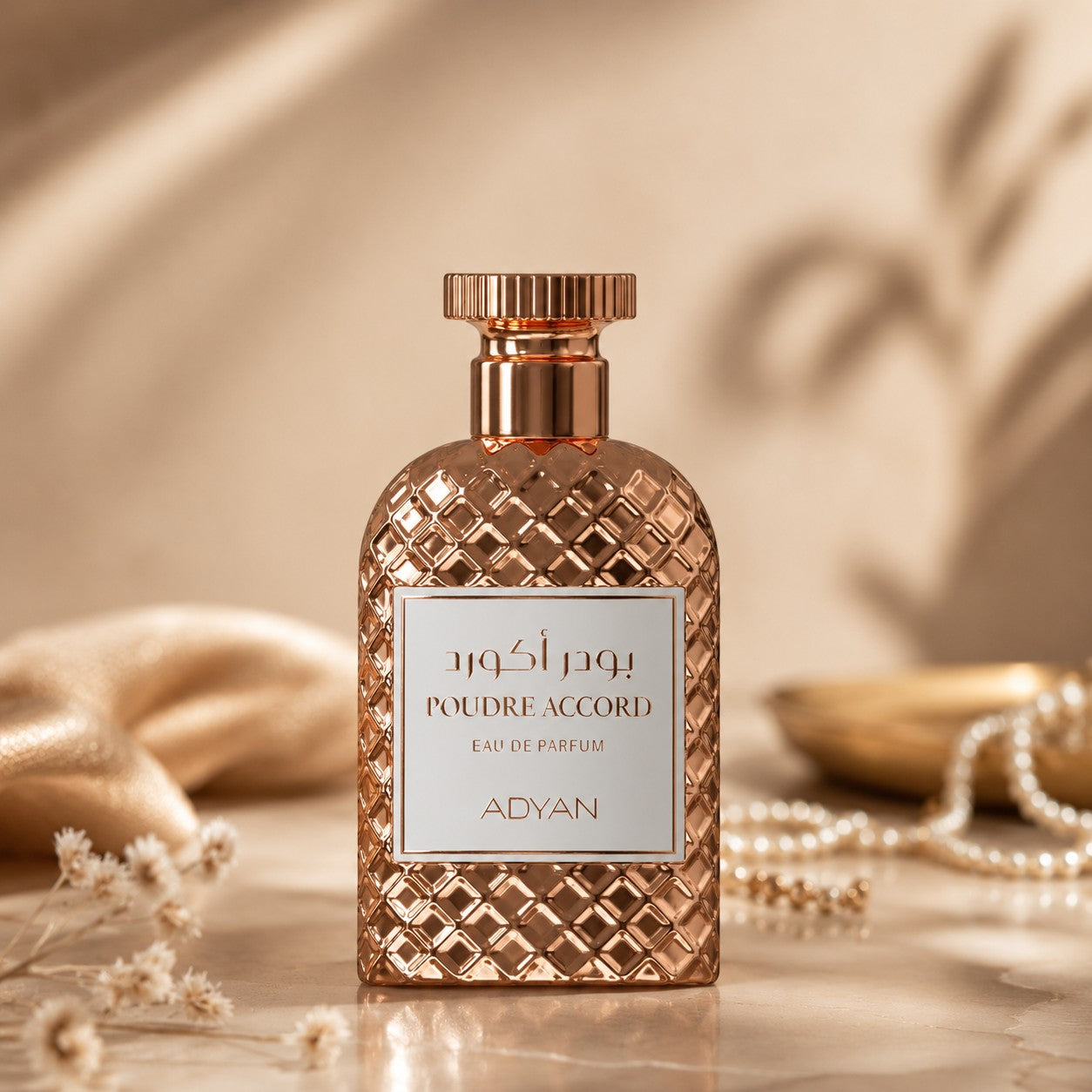 Soghaat Poudre Accord by Adyan Anfar Eau de Parfum in a rose gold textured bottle with elegant white label.