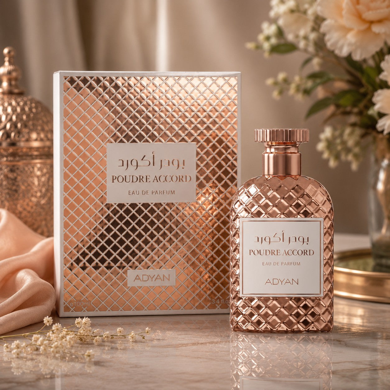 Soghaat Poudre Accord by Adyan Anfar Eau de Parfum bottle and box with rose gold lattice pattern on marble surface.