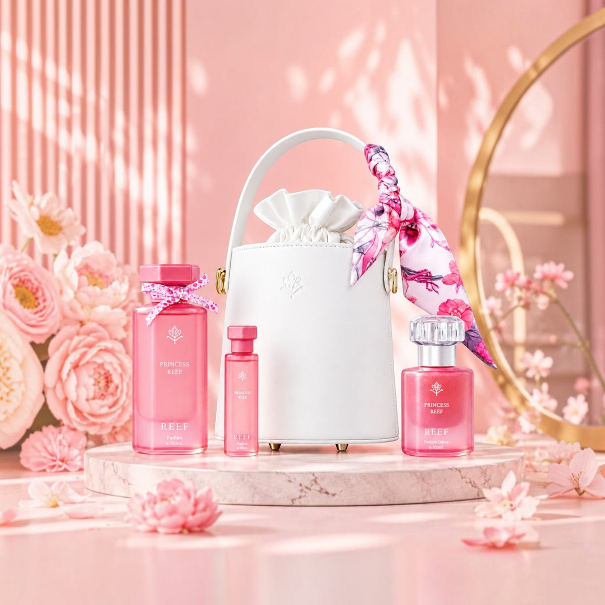 Soghaat Princess Reef perfume gift set featuring three pink bottles and a white handbag on a marble pedestal.
