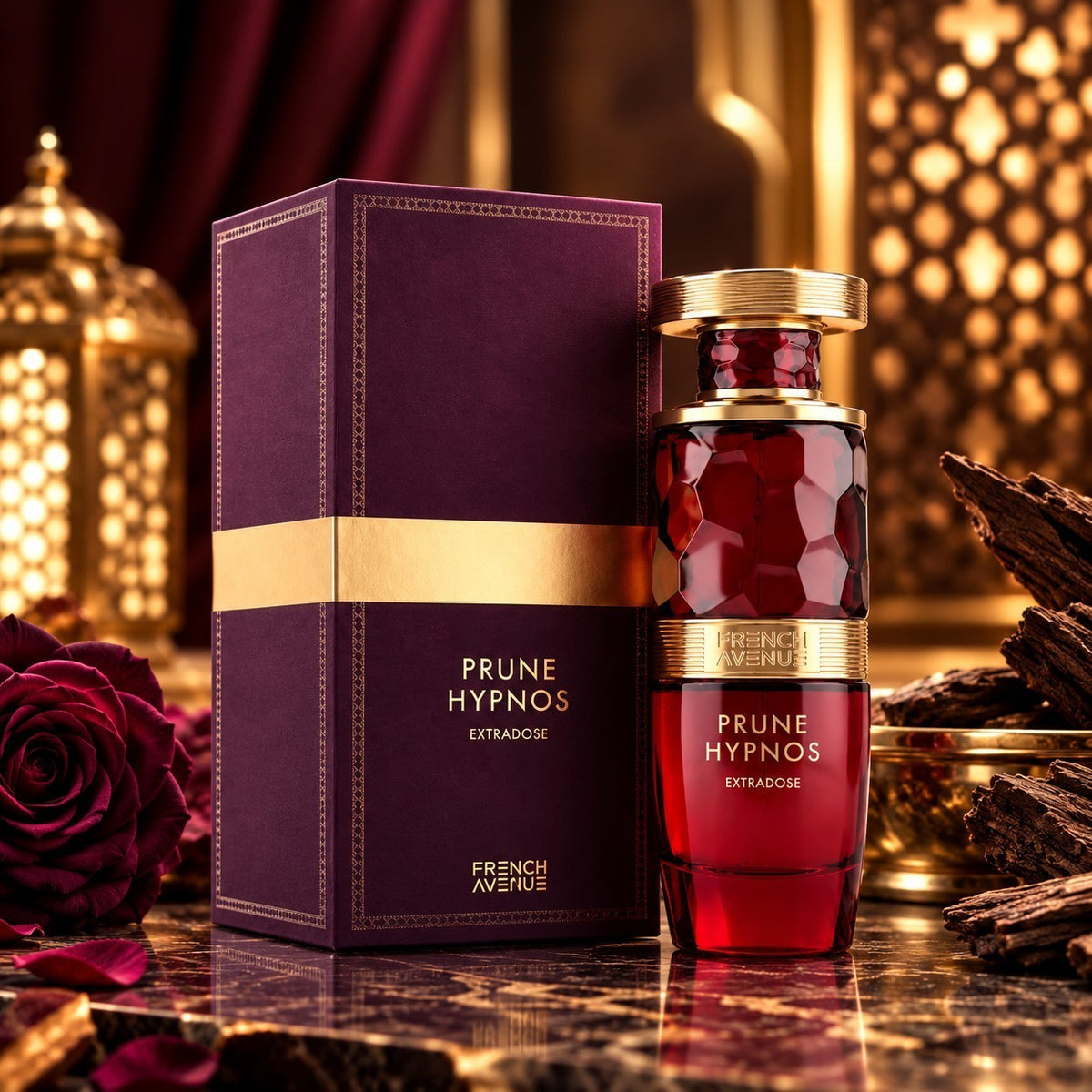 Soghaat French Avenue Prune Hypnos Extradose perfume bottle and box with deep red glass and gold accents on marble.