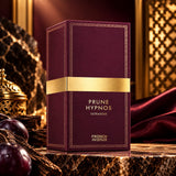 Soghaat Prune Hypnos Extradose perfume bottle in a deep plum box with gold accents, set against a luxurious backdrop.