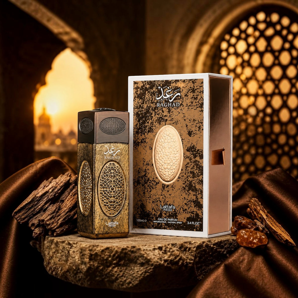 Soghaat Raghad 100ml Eau de Parfum bottle and box with ornate gold textured details, set against a sunset background.