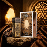Soghaat Raghad 100ml Eau de Parfum bottle and box with ornate gold textured details, set against a sunset background.