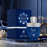 Soghaat Rare Reef by Afnan 100ml Extrait de Parfum in a deep blue bottle and matching box on a marble display.