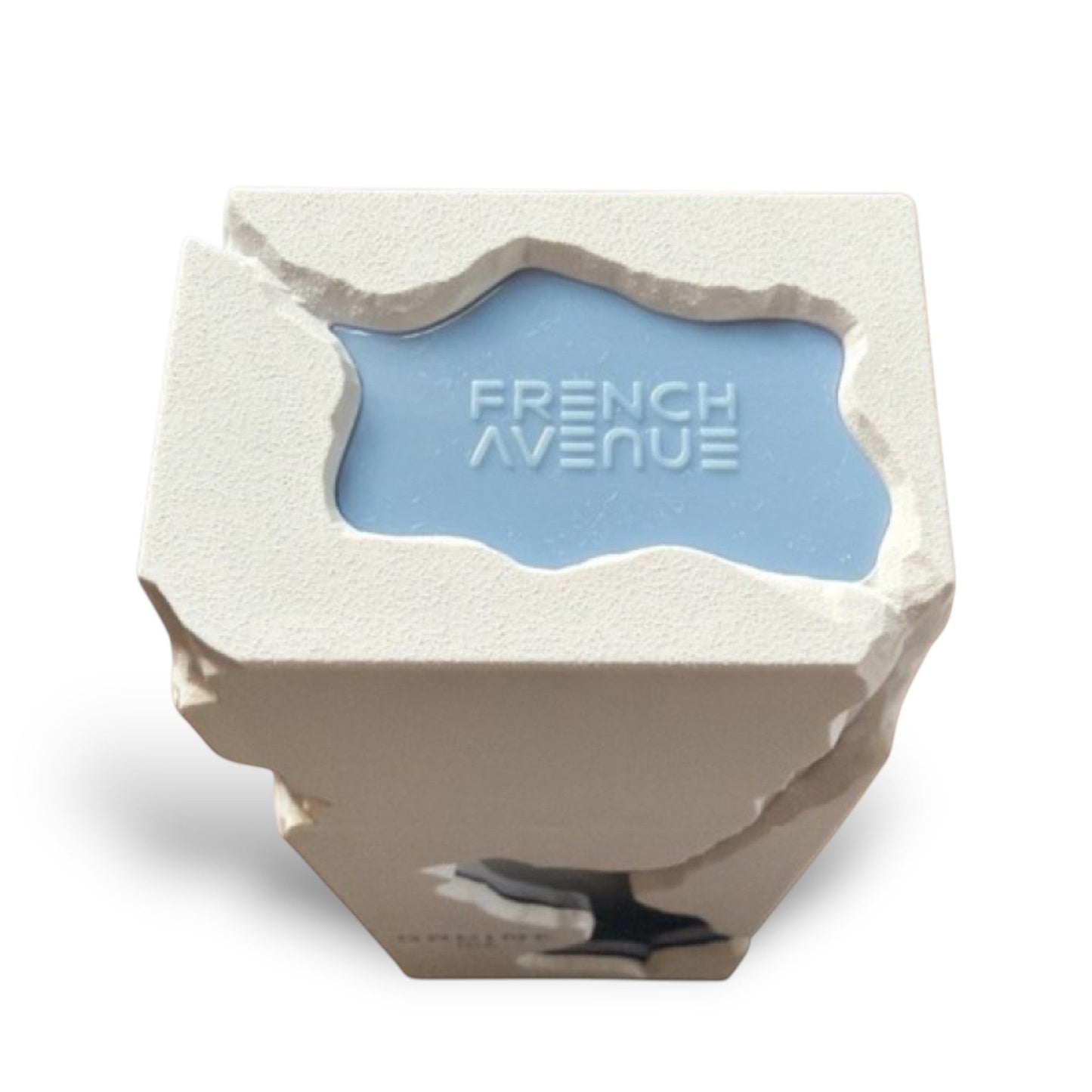 Soghaat Ravine Ice Extrait de Parfum bottle with a textured white exterior and a light blue inset displaying "FRENCH AVENUE" in raised white lettering.
