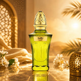 Soghaat Rawdha 50ml Extrait de Parfum in a green glass bottle with a gold cap, set against a warm, sunlit background.