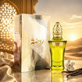 Soghaat Rawdha Extrait de Parfum in a green glass bottle with gold cap next to its elegant box at sunset.