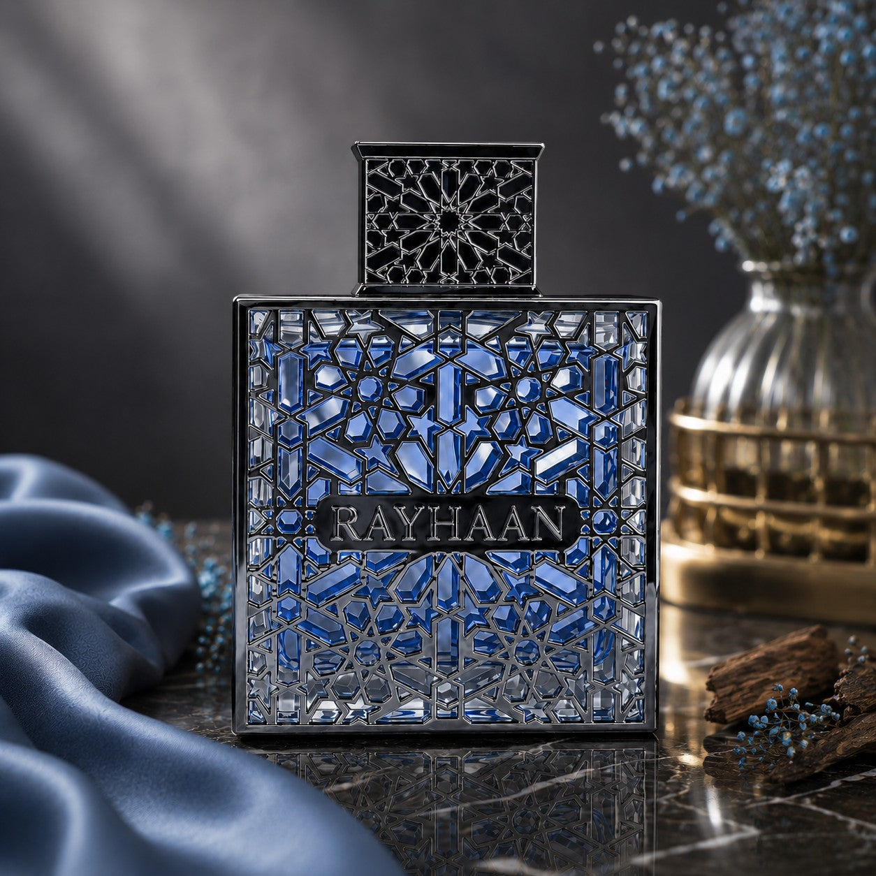 Soghaat Rayhaan Aquatica Eau de Parfum in a square blue glass bottle with an intricate silver lattice overlay.