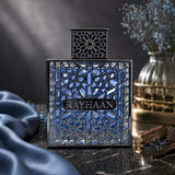 Soghaat Rayhaan Aquatica Eau de Parfum in a square blue glass bottle with an intricate silver lattice overlay.
