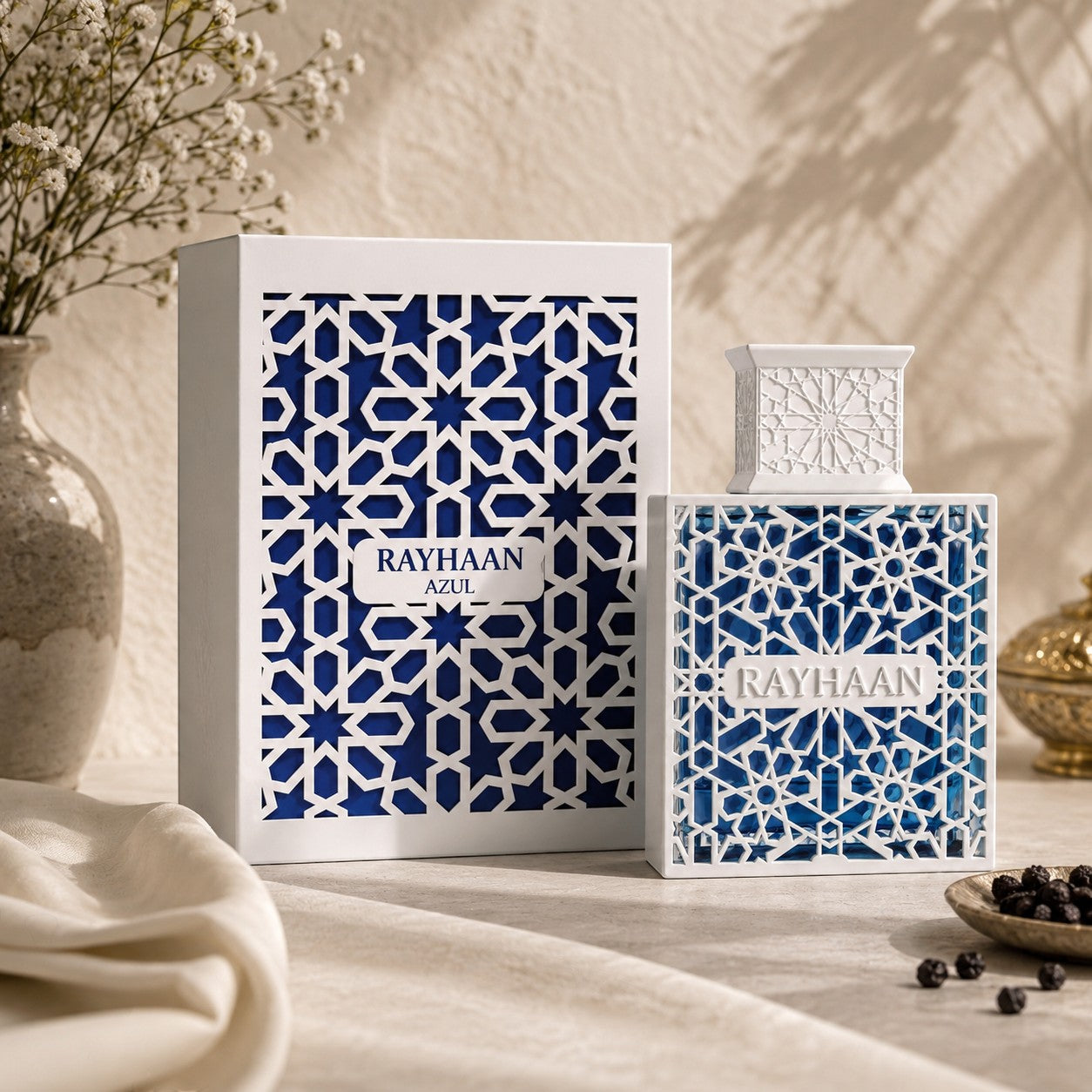 Soghaat Rayhaan Azul Eau de Parfum for men in a blue bottle with white geometric lattice, featuring citrus and wood.
