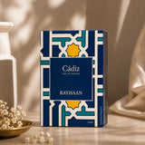Soghaat Rayhaan Cadiz Eau de Parfum 100ml, amber woody oriental fragrance with blue and gold geometric pattern.