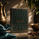 Soghaat Rayhaan Terra Eau de Parfum bottle in a decorative metallic lattice case with teal accents on a table.