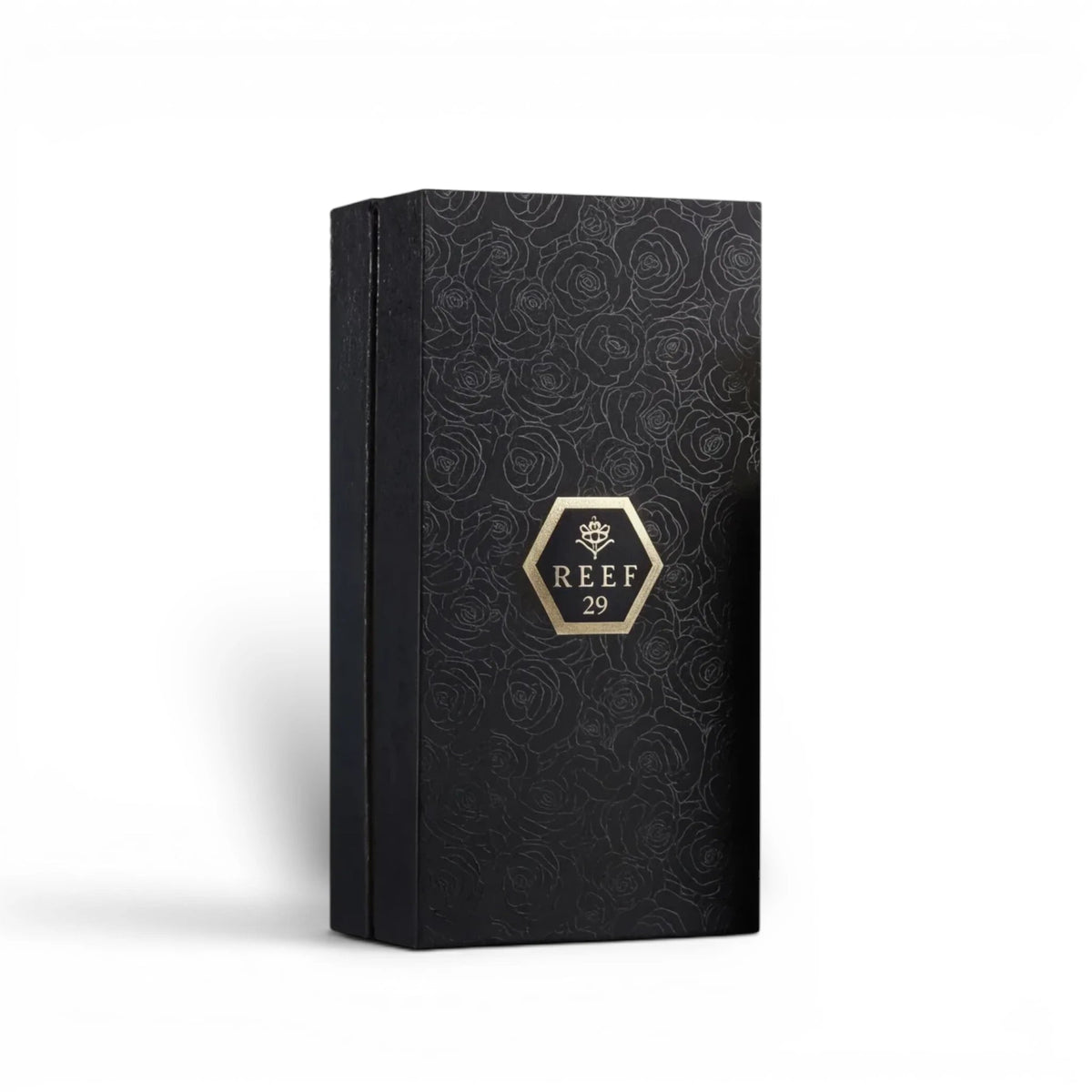 Soghaat Reef 29 Eau de Parfum in a black rectangular box with embossed rose patterns and a gold hexagonal logo.