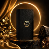 Soghaat Reef 42 Eau de Parfum in a black embossed box on a marble pedestal with gold accents and a glowing ring light.
