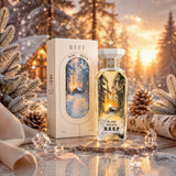 Soghaat Reef Blanc Breath 150ml unisex Eau de Parfum bottle and box in a snowy winter forest setting at sunset.