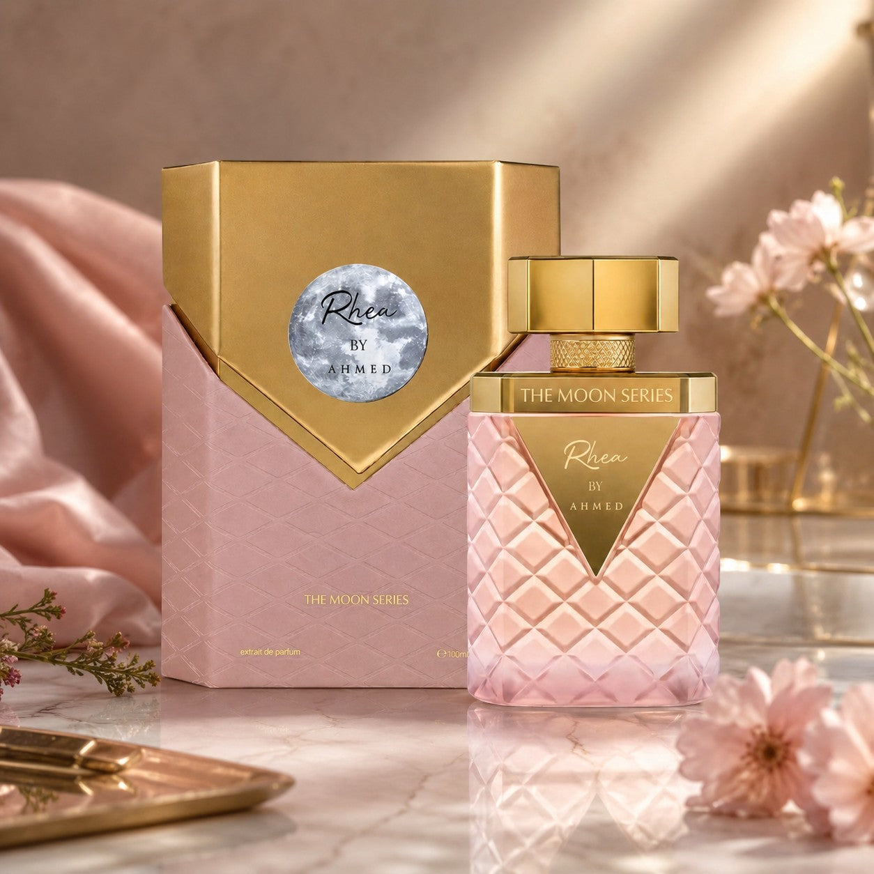 Soghaat Rhea Extrait de Parfum in a quilted pink glass bottle with a gold cap, displayed next to its matching box.