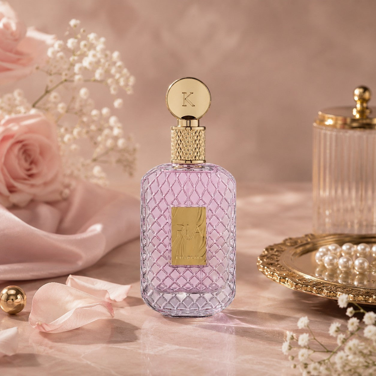 Soghaat Ria Eau de Parfum, a 100ml bottle with a pink gradient glass body and gold cap, featuring a gold label.