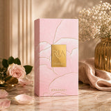 Soghaat Ria 100ml Eau de Parfum box with pink floral design and gold accents. Features roses and baby's breath.