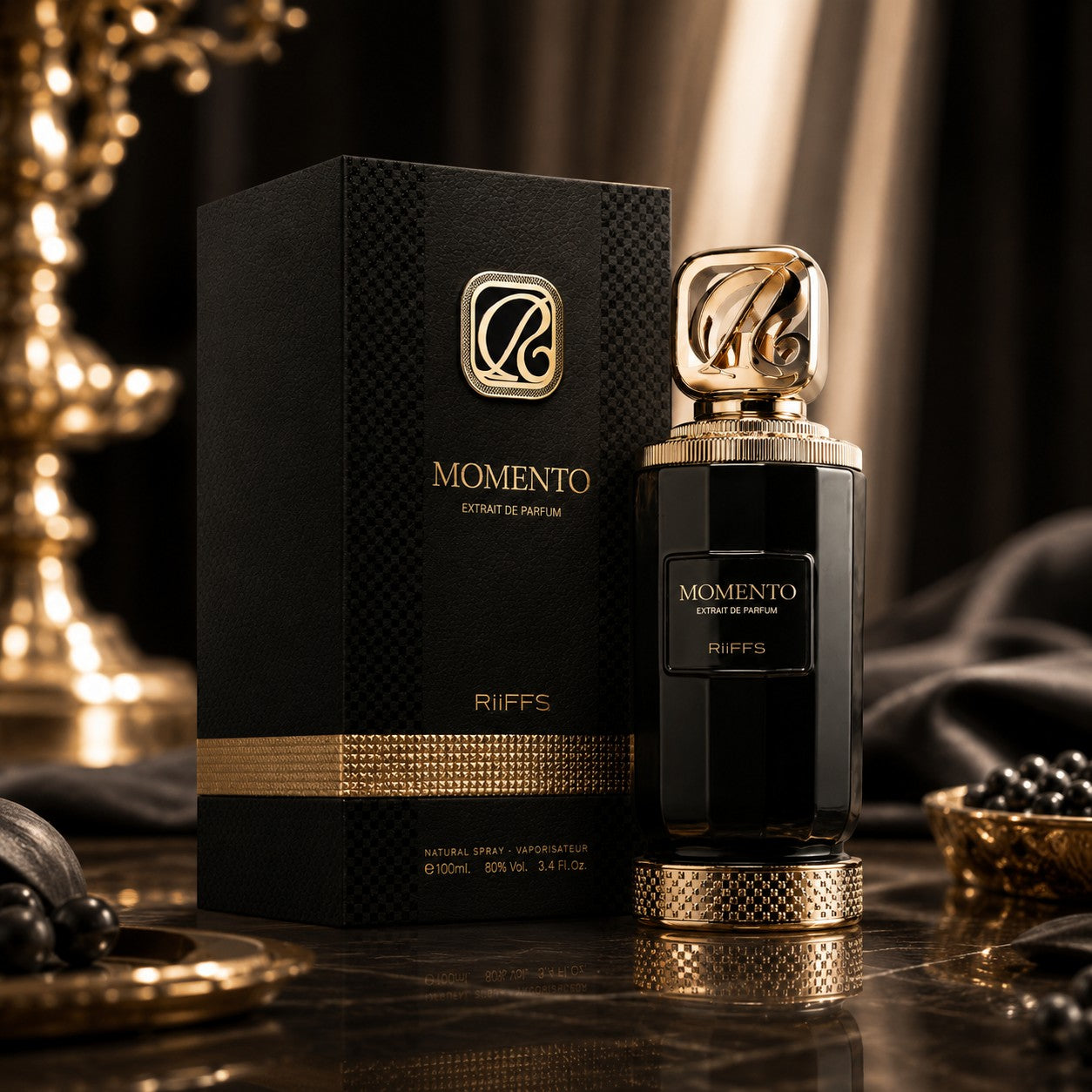 Soghaat RiiFFS Momento 100ml Extrait de Parfum bottle and black textured box with gold accents on a marble surface.