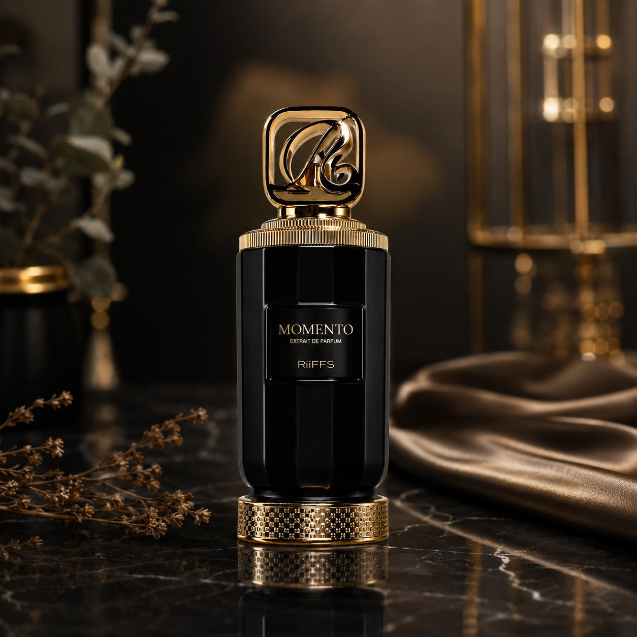 Soghaat RiiFFS Momento Extrait de Parfum in a sleek black bottle with gold accents on a dark marble surface.