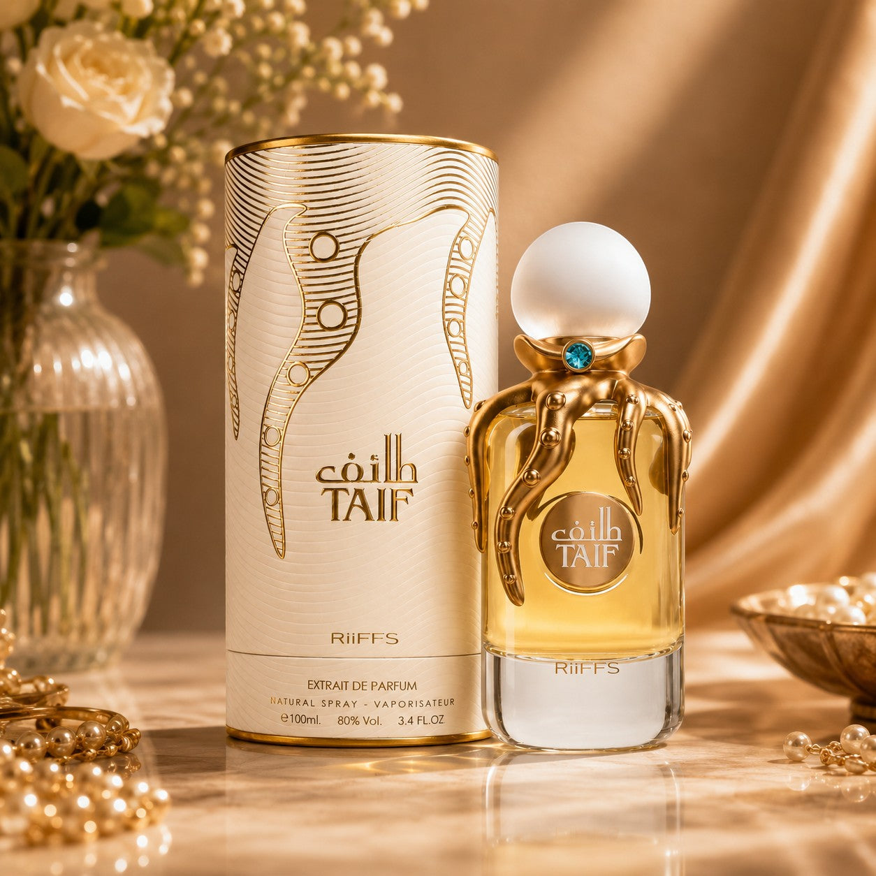 Soghaat RiiFFS Taif Extrait de Parfum bottle with gold octopus-like tentacles and white cap next to its matching box.